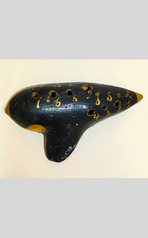 <h3>Ocarina</h3>
<p><i>Made by H. Fiehn</i></p>
<br>
<p><strong>Late nineteenth/early twentieth century
<br>
Gift of Alan Richard</strong></p>
<br>
<br>
<p>A program in this exhibit lists a solo “occarina” performance. (The usual spelling is one with one “c”). Although wind instruments of this type were known for centuries in many lands, the ocarina we are familiar with today was only revived in the nineteenth century. Many ocarinas, including this example, were made in Vienna by Heinrich Fiehn who flourished between 1876 and 1920. By including an ocarina solo, we see that Oysterponds musicians were very up to date in their musical tastes!</p>