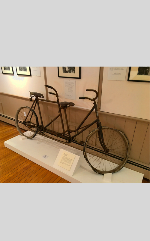 <h3>Bicycle Built For Two</h3>
<br>
<p><i>Maker unknown</i><p>
<br>
<p><strong>1Early twentieth-century
<br>
Gift of George R. Latham</strong></p>
<br>
<br>
<p>A tandem bicycle (a bicycle built for two) is designed to be ridden by more than one person. Tandem refers to the seating arrangement – one in front, others behind – rather than the number of riders. The earliest patents for tandem bicycles date from the  1890s – the decade of the craze for bicycling. <i>Daisy Bell (Bicycle Built for Two</i>) is a song written in 1892 with the famous chorus: “Daisy, Daisy / Give me your answer, do. / I’m half crazy / all for the love of you. / It won’t be a stylish marriage. / I can’t afford a carriage. / But you’d look sweet / upon the seat of a bicycle built for two.”
There are serious condition issues with this bicycle, but it is the tandem bicycle used in the pageant and is the only tandem bicycle in the OHS collections.</p>