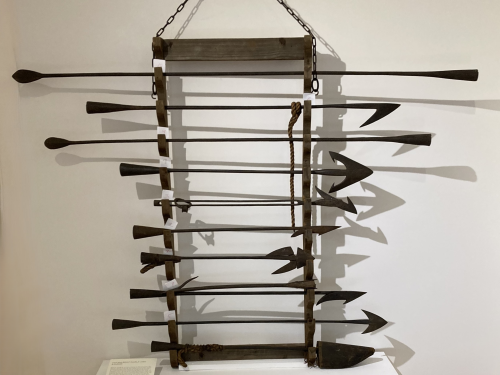 12 harpoons, flensing irons, and other whaling equipment; part of the "Recent Acquisitions" exhibition.